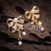 Golden Bow-Tie Splendid Dangle Ear Stud Earrings